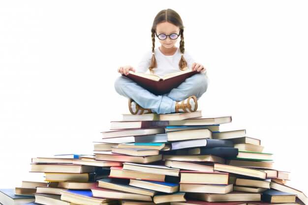 concentrated girl surrounded by books 1098 2136 1